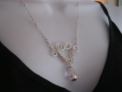 Hand-formed Wire Heart with pink glass crystals Hand-formed Wire Heart with pink glass crystals